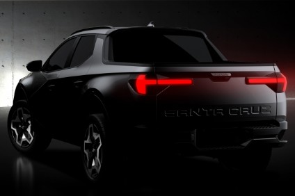 Teaser shows a four door cab. There will be powertrain choices and all wheel drive