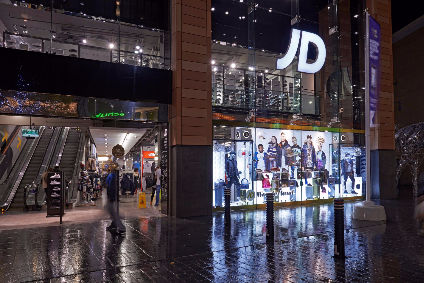 shift to online weighs on JD Sports H1 
